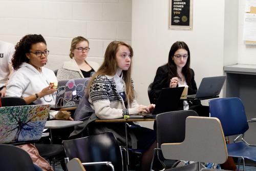 Students listening and sitting in an Anthropology of Latin America course
